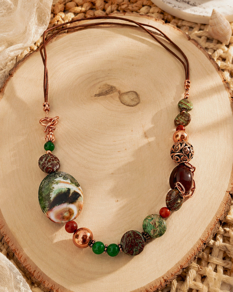 Forest Path Necklace
Jade, jasper, agate, wood, copper, and leather