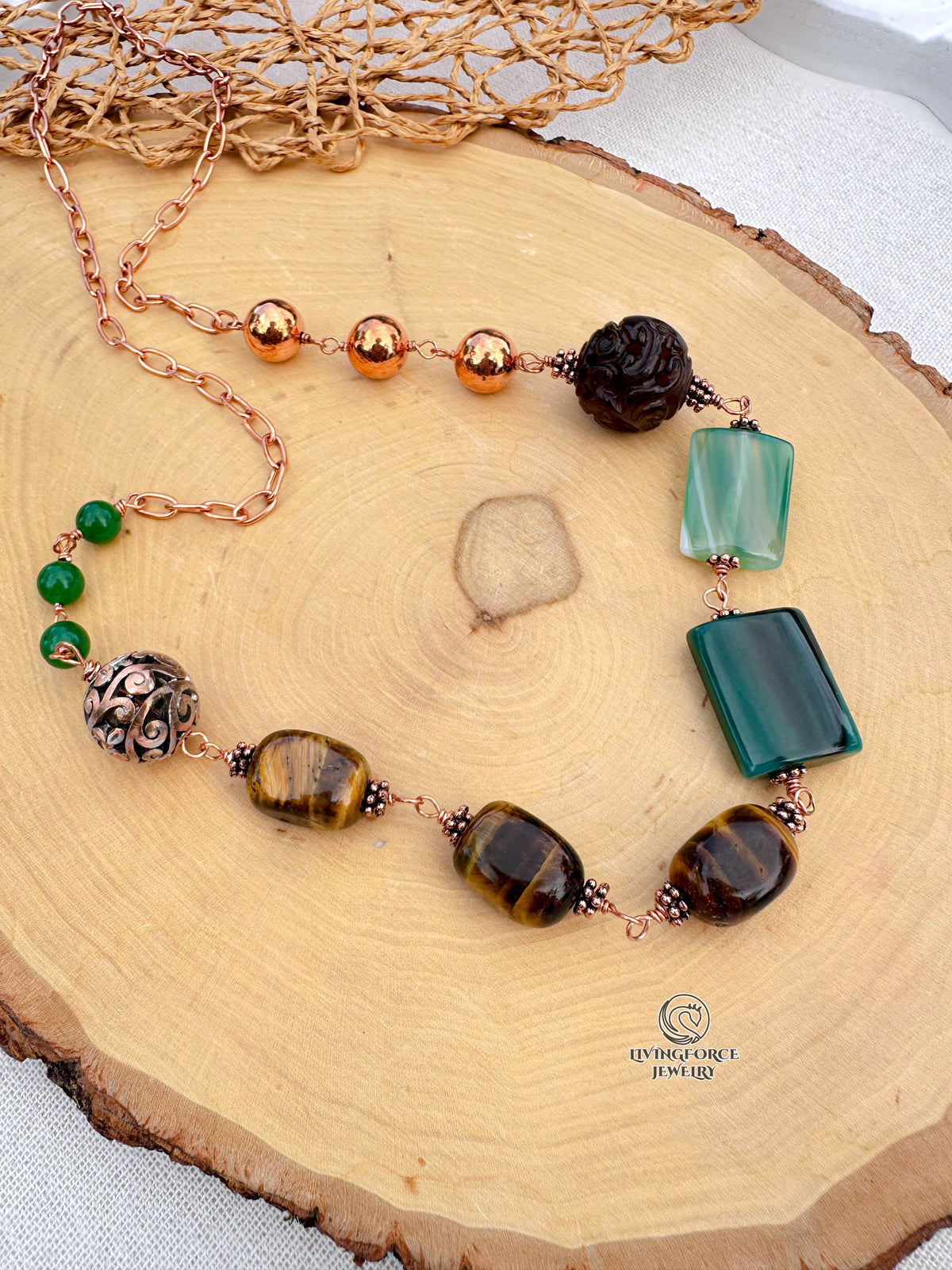 Green Terra Necklace
Jade, agate, and tiger eye in copper.