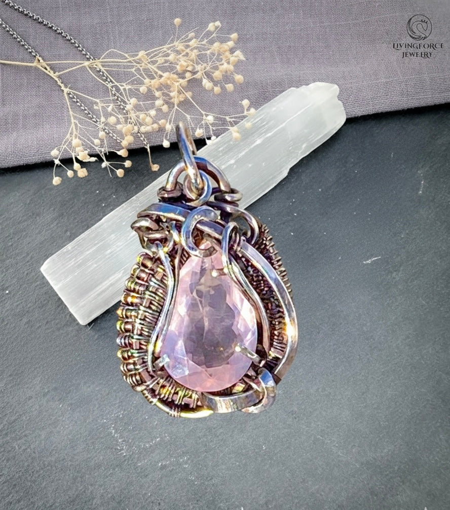 Handmade Eden pendant with a faceted rose quartz stone in a sterling silver wire wrapped and prong setting by Livingforce Jewelry.