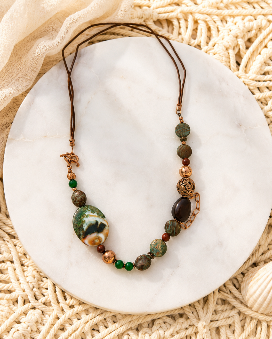 Forest Path Necklace

Jade, jasper, agate, wood, copper, and leather