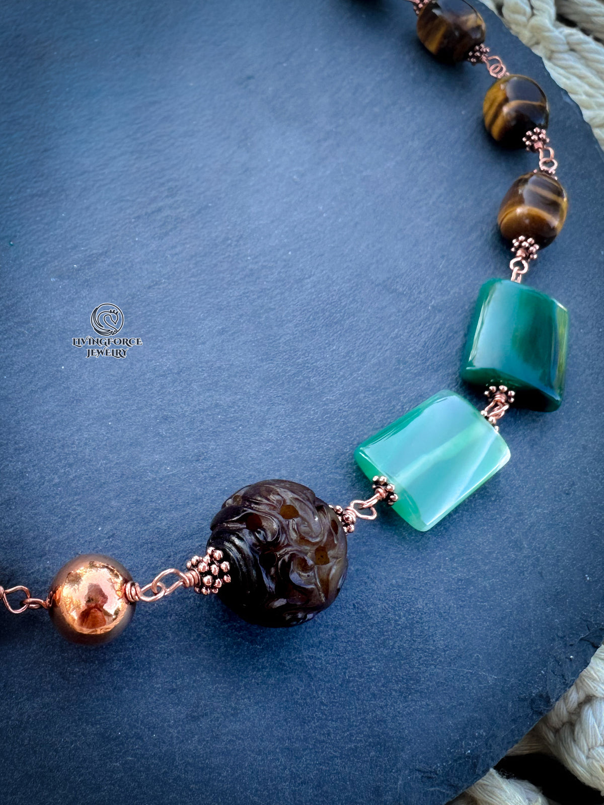 Green Terra Necklace

Jade, agate, and tiger eye in copper.