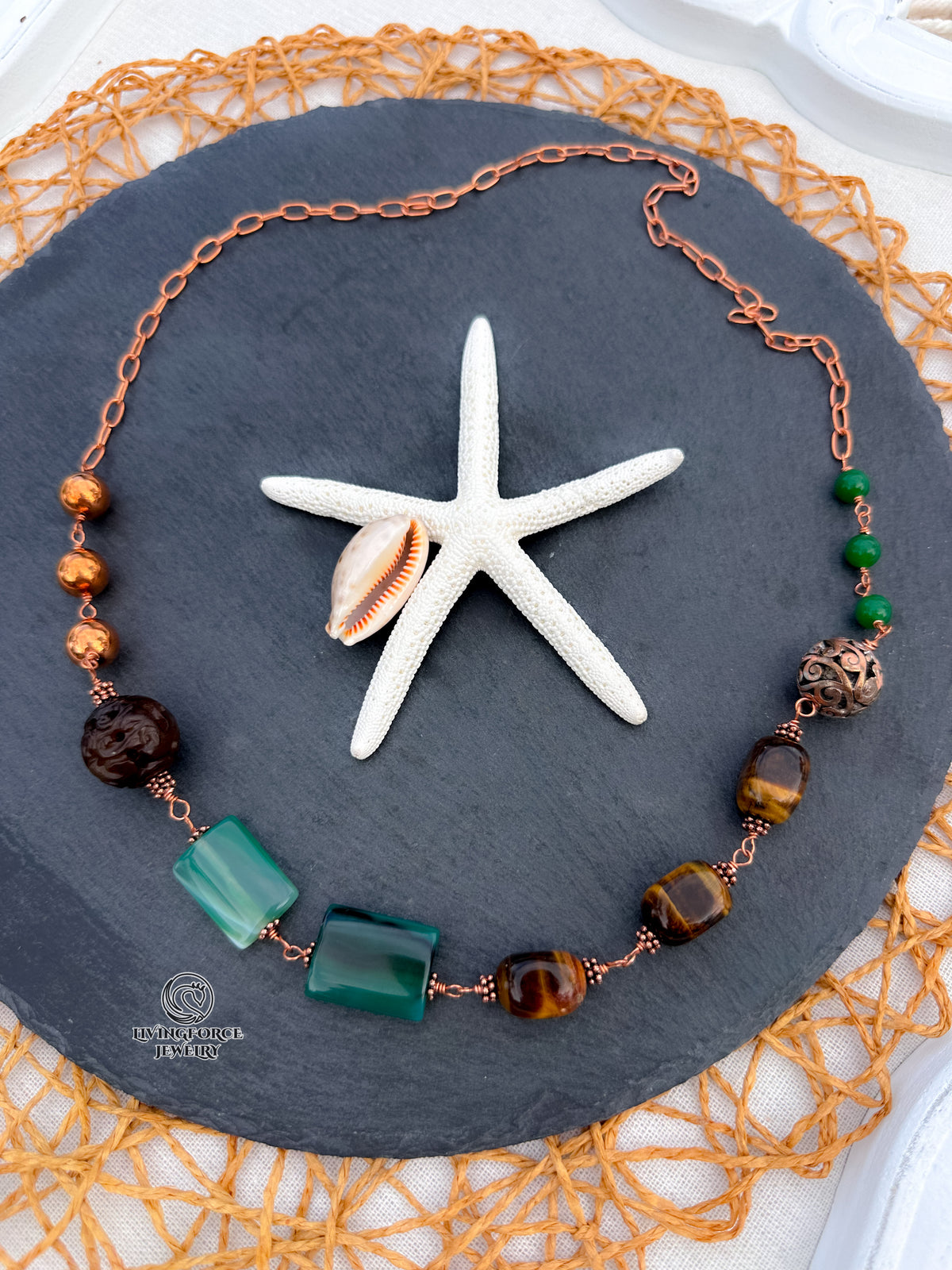Green Terra Necklace

Jade, agate, and tiger eye in copper.