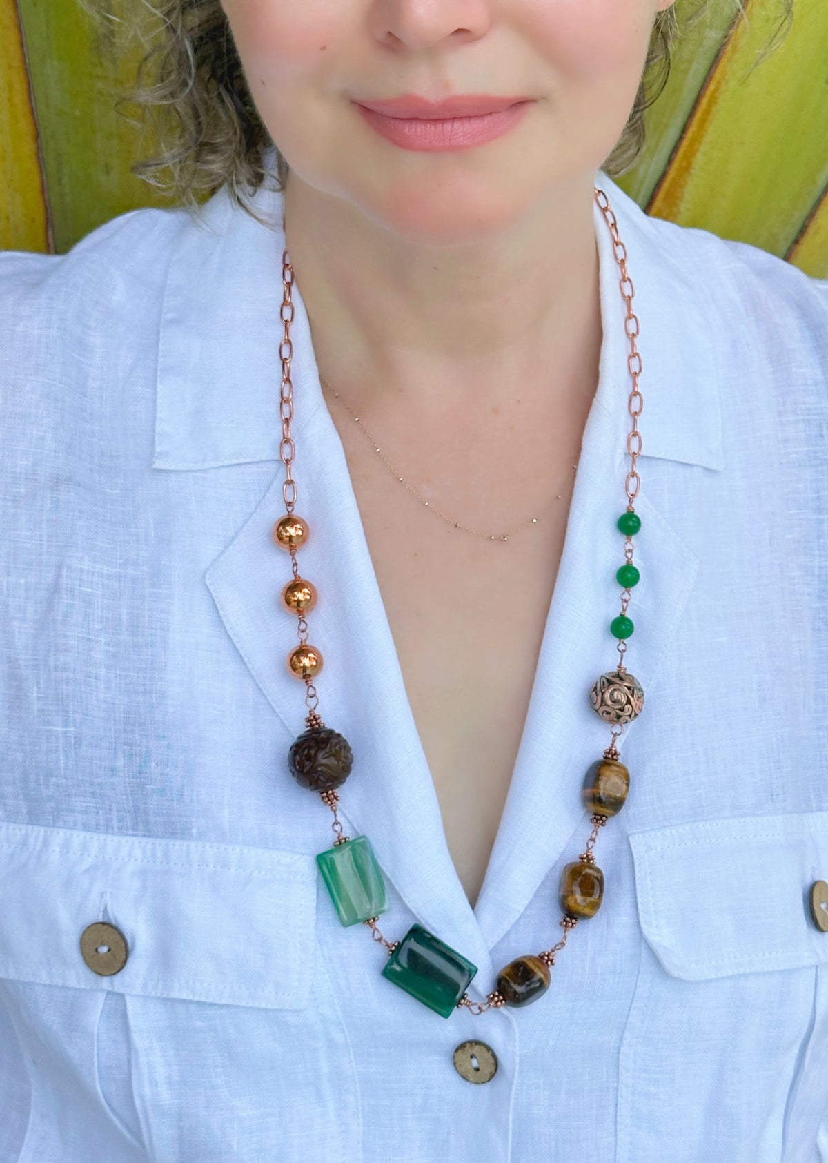 Green Terra Necklace

Jade, agate, and tiger eye in copper.