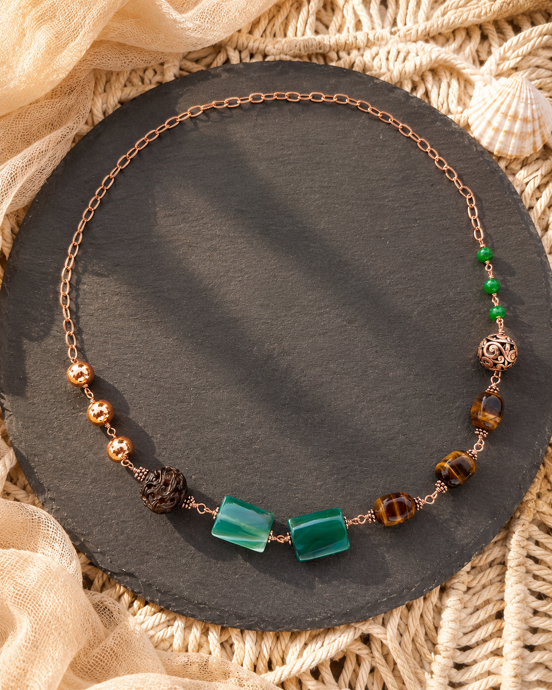 Green Terra Necklace

Jade, agate, and tiger eye in copper.
